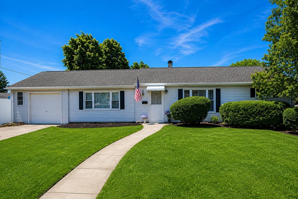 Charming suburban home with bright landscaping Charming suburban home with bright landscaping